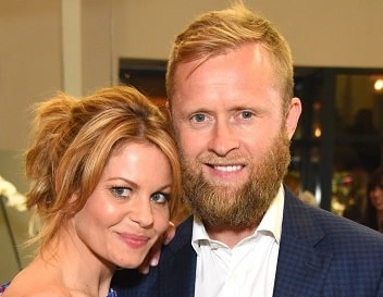 A picture of Former Russian ice hockey player, Valeri Bure and his wife, actress Candace Cameron.